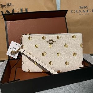NWT in-box Coach wristlet wallet with gold metallic apple print